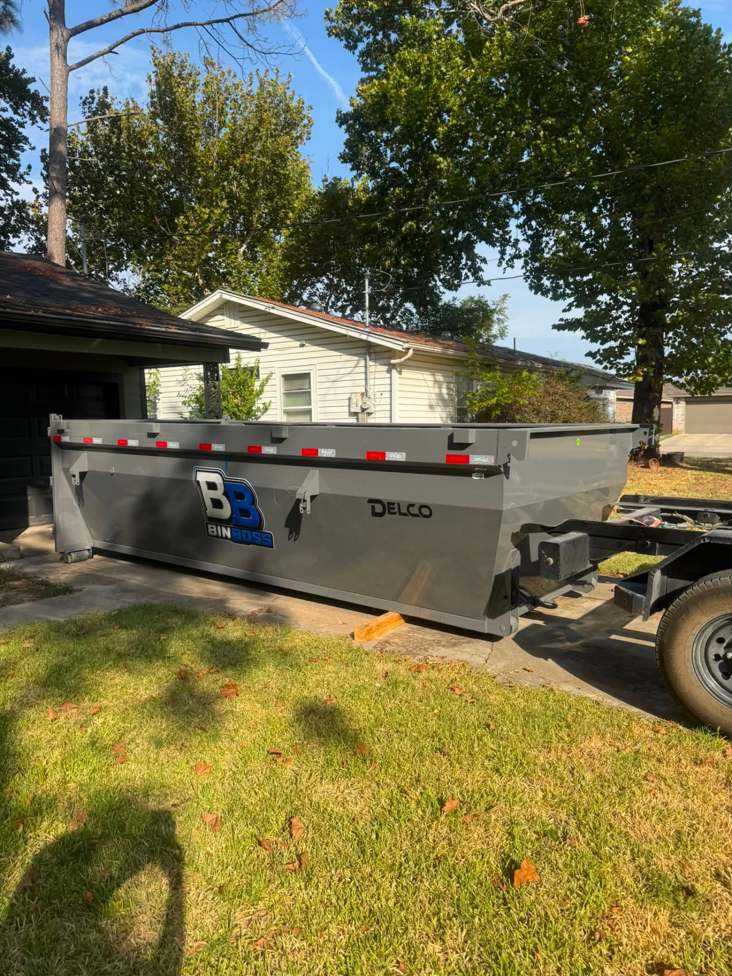 BinBoss DFW roll-off dumpster placed on a residential driveway in Johnson County, Texas